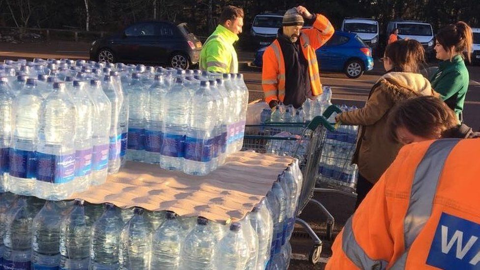 Bottled water being distributed