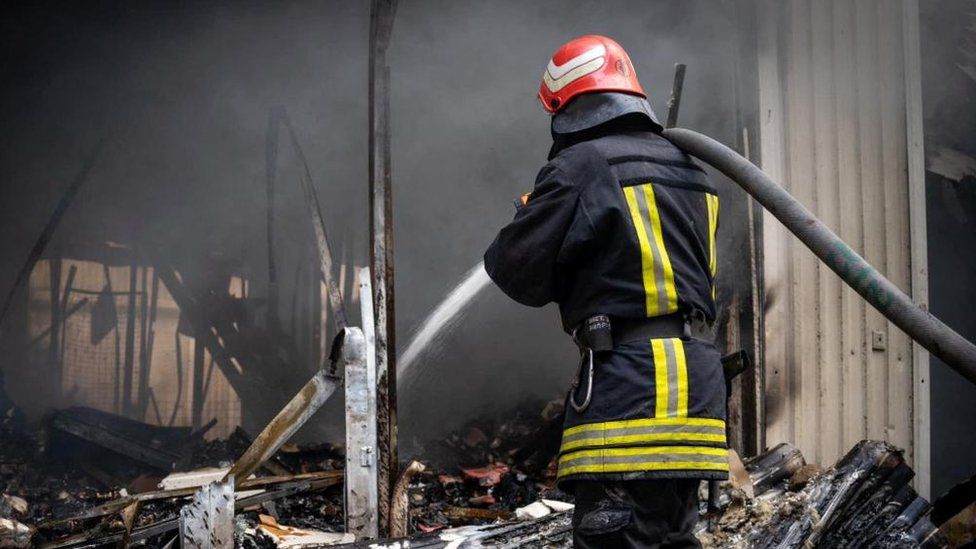Ukrainian firefighters tackle a blaze in Odesa at grain storage facility