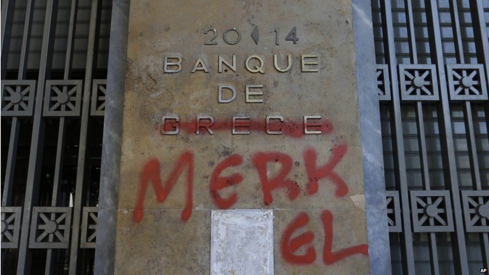 Bank of Greece plaque with Merkel graffiti