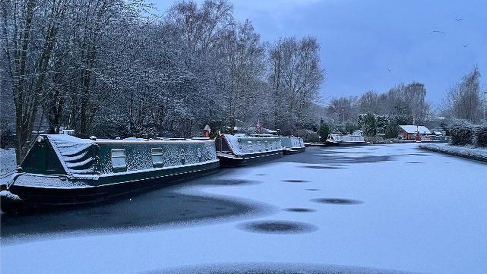 Boats covered in snow