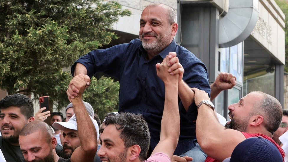 Opposition candidate Yassin Yassin is greeted by his supporters in Joub Jannine, West Bekaa, Lebanon (16 May 2022)