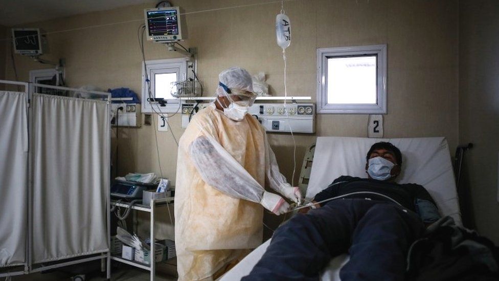 A nurse looks after a Covid-19 patient in Buenos Aires, Argentina, 24 June 2020