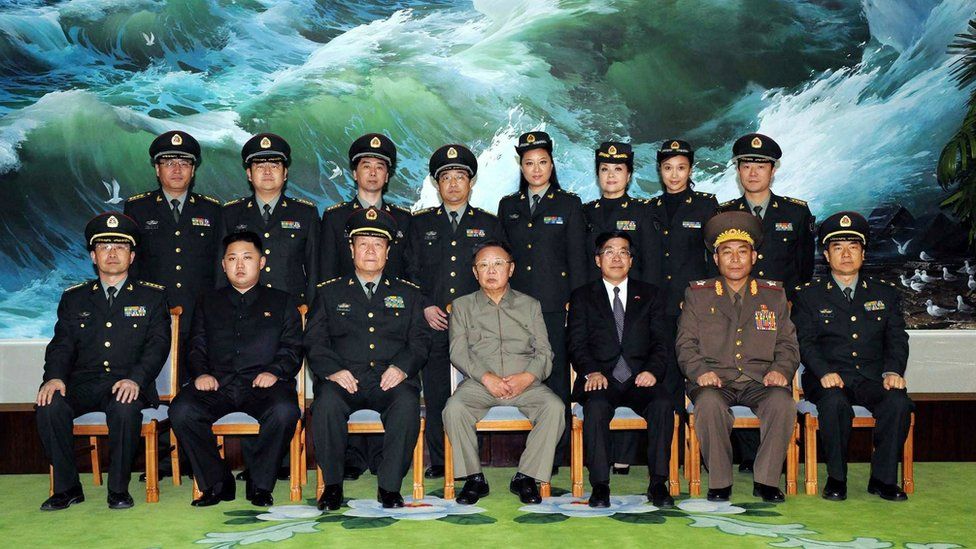North Korean leader Kim Jong-Il (front row-C) and his son Kim Jong-un (front row-2nd L) posing with Chinese officers in October 2010