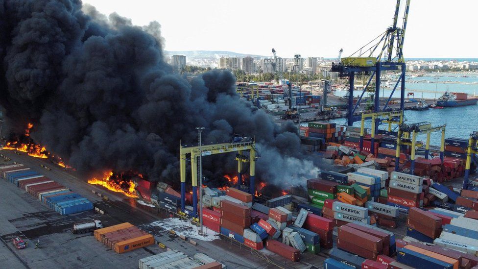 Smoke rises from burning containers at the port in the earthquake-stricken town of Iskenderun