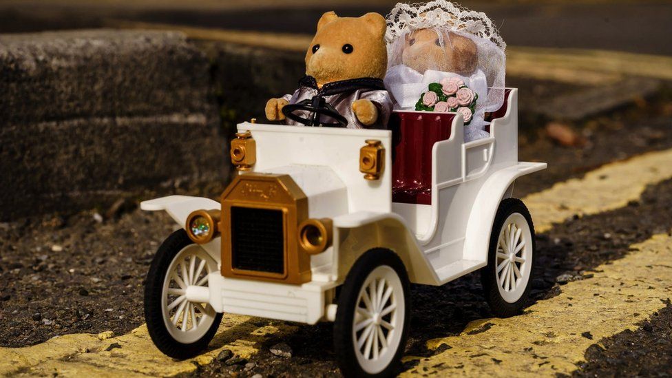 Sylvanian families toys in a small wedding car
