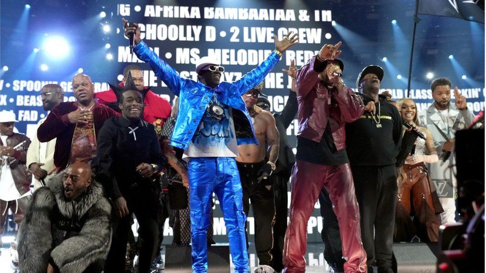 Performers such as LL Cool J, Flavor Flav, Busta Rhymes, Lil Uzi Vert, Nelly, Spliff Star, Queen Latifah, Ice-T, Chuck D, Joseph Simmons, Darryl McDaniels, Grandmaster Flash, and Black Thought perform on stage at the Grammys