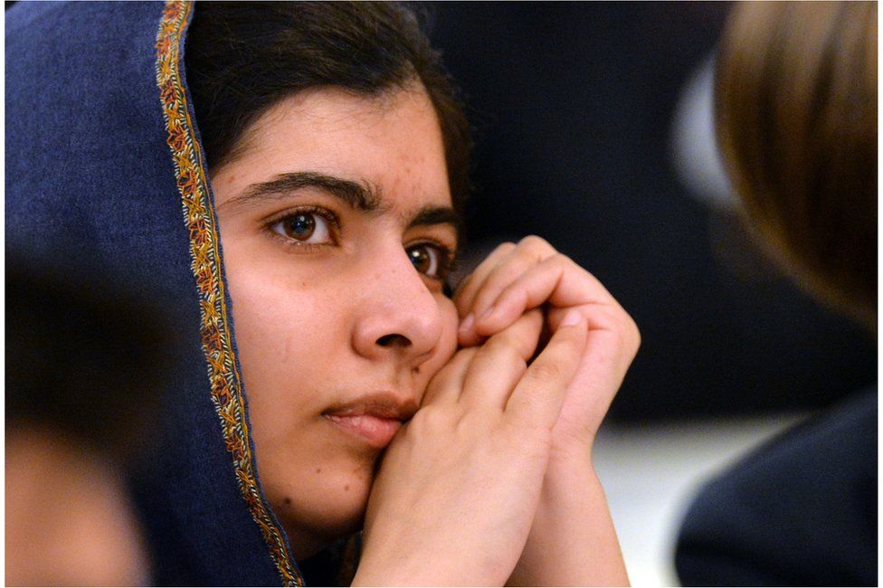 Pakistani activist for female education and Nobel Peace Prize laureate Malala Yousafzai listens to speakers at an event to commemorate the Peshawar school massacre in Birmingham, north England on 14 December 2015