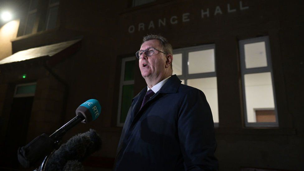 DUP leader Sir Jeffrey Donaldson speaks to the media before attending an Anti-NI Protocol rally at Dromore Orange Hall