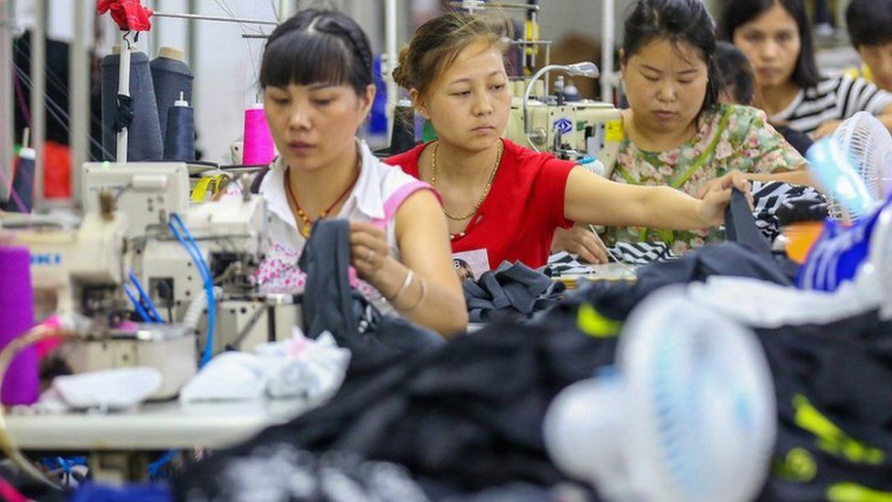 This photo taken on August 2, 2018 shows workers at a swimwear factory in Yinglin town in Jinjiang, in China's eastern Fujian Province
