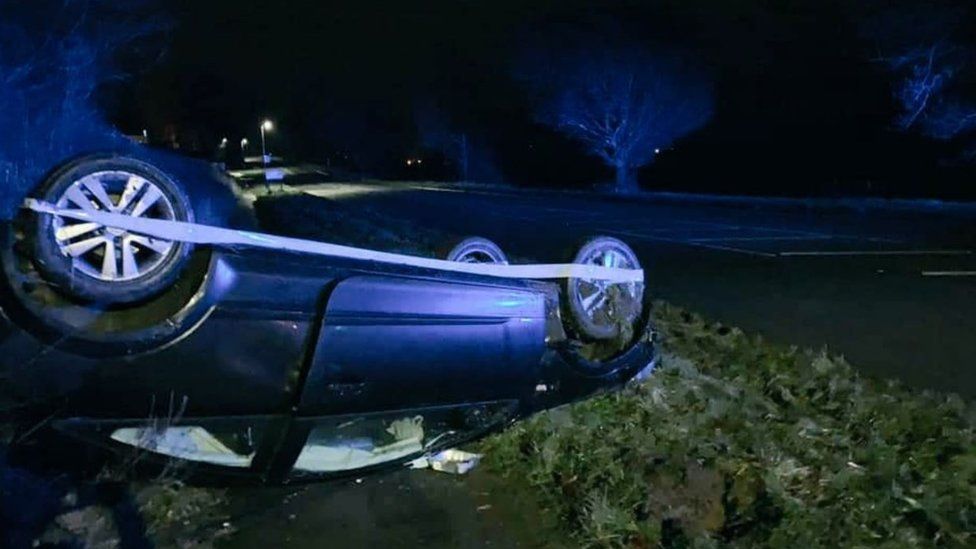 Overturned car on A6013 near Bamford