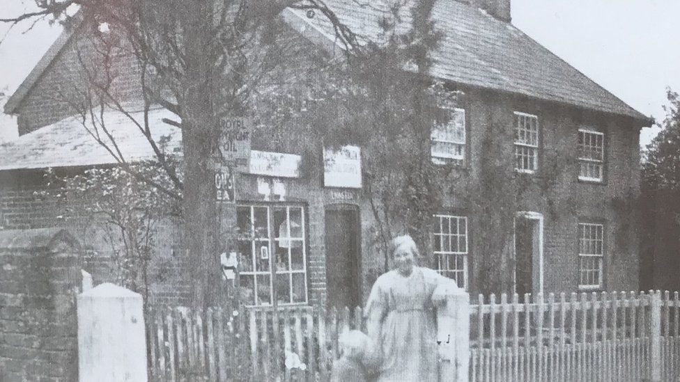 Mrs Robinson outside the old post office building in 1935