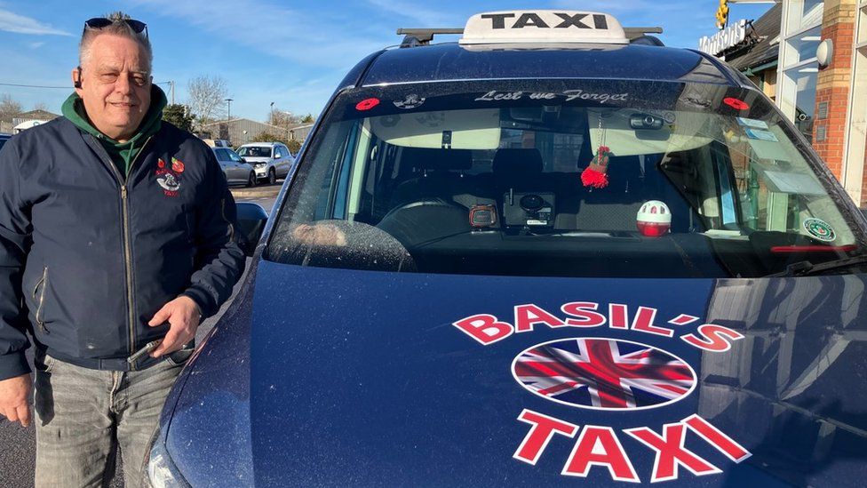 Basil with his taxi