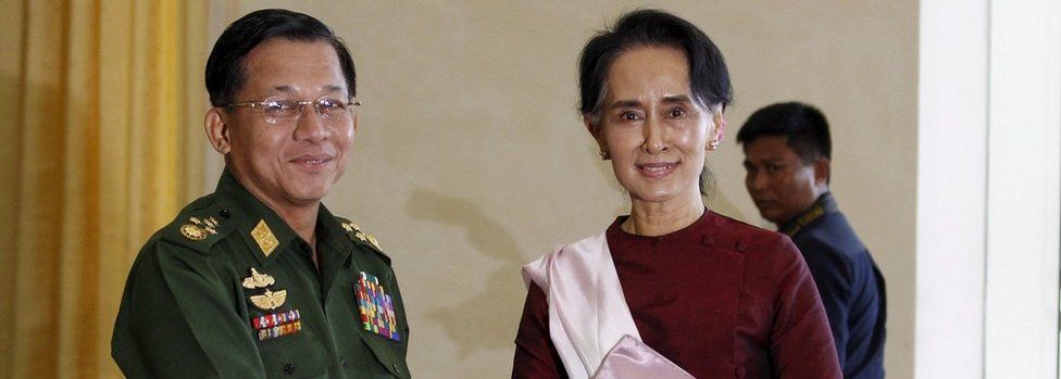 Myanmar"s Commander-in-Chief Min Aung Hlaing (L) shakes hands with National League for Democracy (NLD) party leader Aung San Suu Kyi