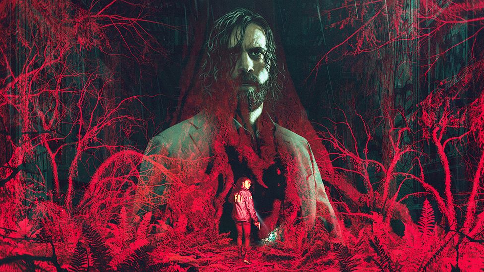 A computer-generated image of a forest made up of gnarled trees, shed of their leaves, and bathed in a menacing red light. A translucent image of Alan Wake, a bearded man with chin-length, straggly hair and wearing a grey suit, is imposed over the top. In the lower part of the image a female wearing a blue jacket with FBI written on the back in yellow letters, looks over her shoulder as she cautiously enters the scene