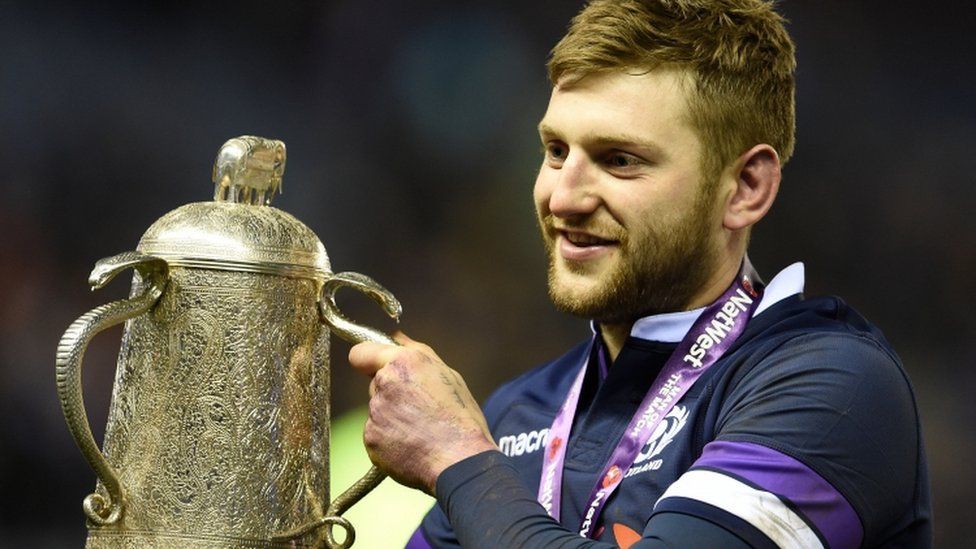 Scotland fly-half Finn Russell celebrates with the Calcutta Cup