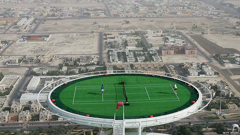 Federer plays Agassi on a helipad
