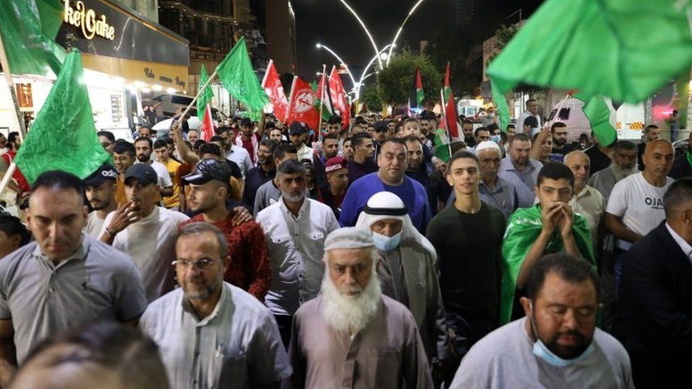 Palestinians celebrate the Gilboa prison break at a rally in Hebron (6 September 2021)