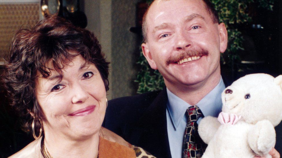 Left to right: Iola Gregory as Mrs. McGurk and Cadfan Roberts as Glan Morris in the Welsh language S4C / BBC television series Pobol y Cwm