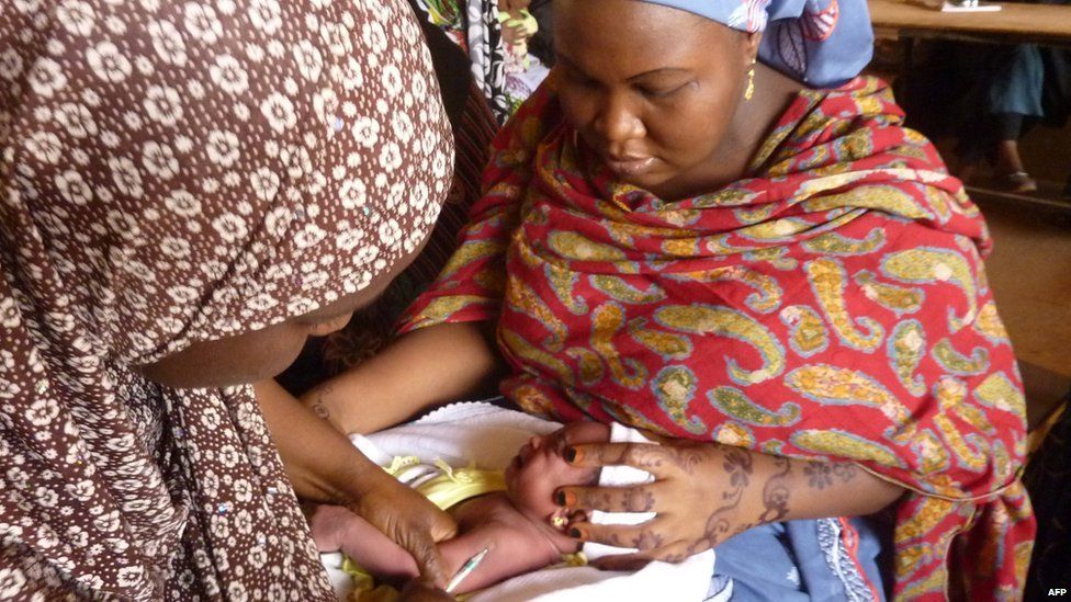 baby receives polio vaccination in nigeria