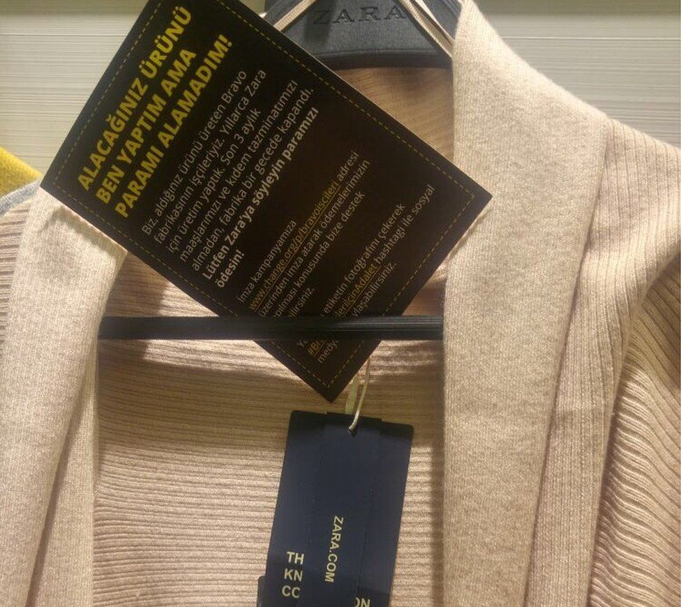 Picture of a Zara product with a tag "I made this item you are going to buy, but I did not get paid for it!"
