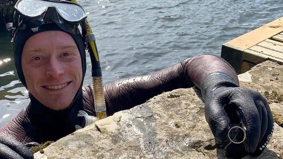Diver Angus Hosking with the lost wedding ring