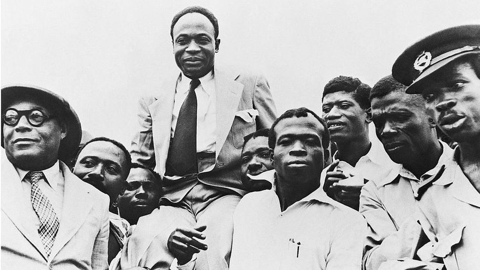 Government officials carry Prime Minister and President Kwame Nkrumah on their shoulders after Ghana obtains its independence from Great Britain.