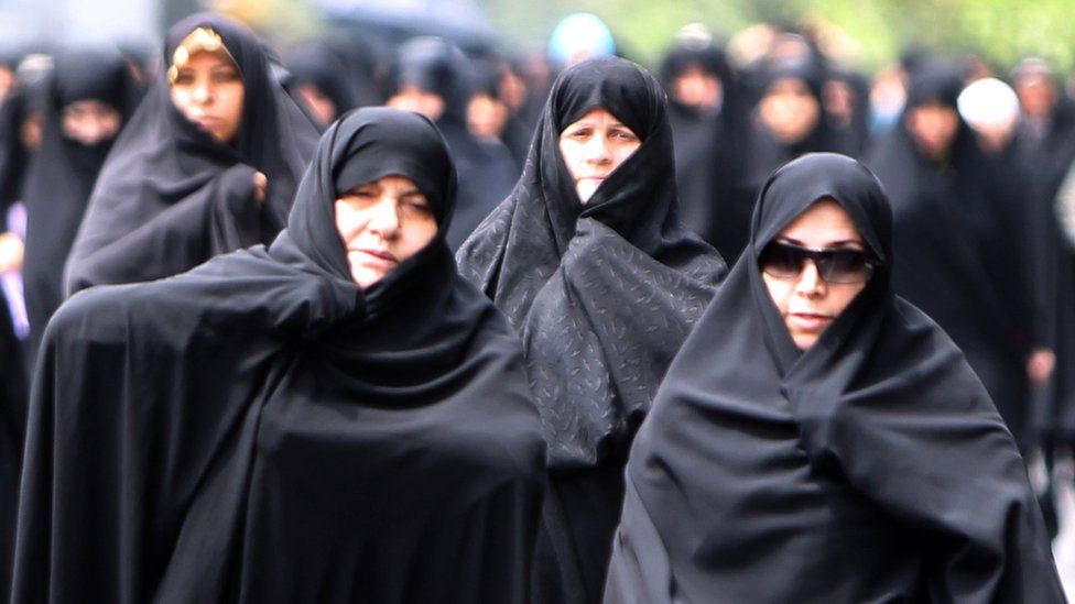 Iranian demonstrators march after weekly Friday prayers in Tehran during a protest on the Islamic dress code, 8 July 2011