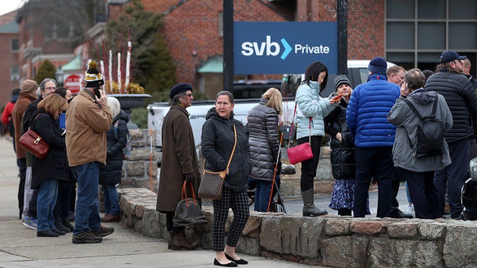 Bank customers line up outside Silicon Valley Bank following its collapse