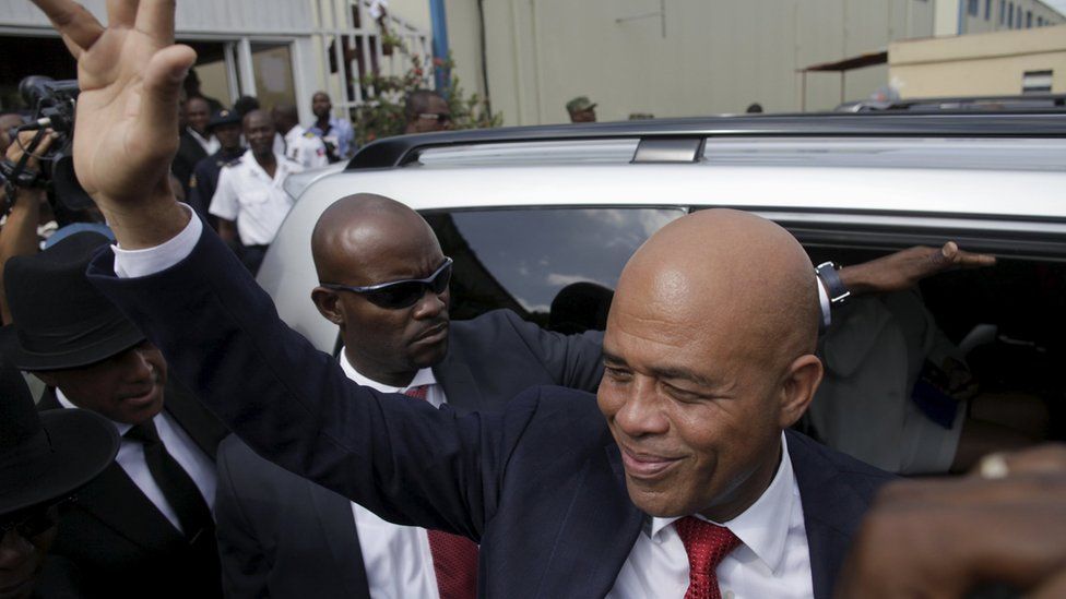 Martelly says goodbye after a ceremony marking the end of his presidential term, at the Haitian Parliament in Port-au-Prince, Haiti