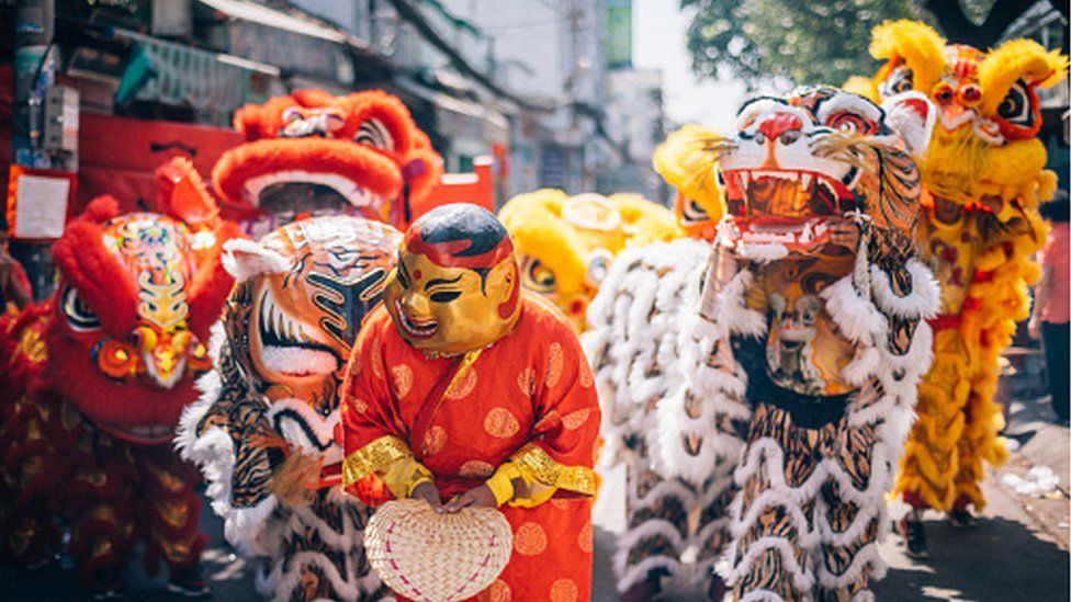 Lion dancers in a Lunar New Year parade in Ho Chi Minh City, Vietnam