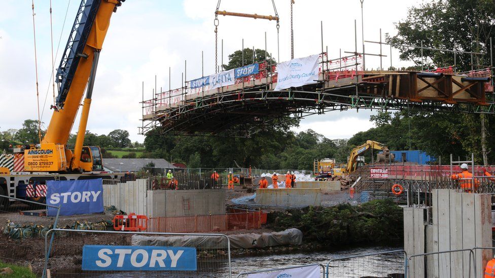 The bridge framework being lowered into position