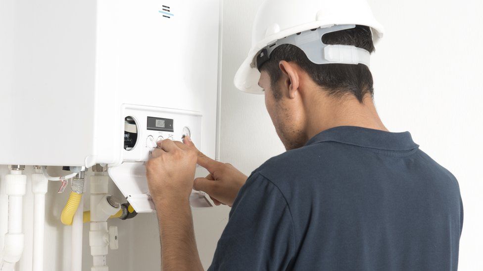 Man installing a boiler