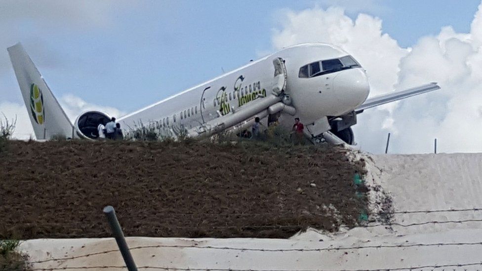 A Toronto-bound Fly Jamaica airplane is seen after crash-landing at the Cheddi Jagan International Airport in Georgetown, Guyana on November 9, 2018