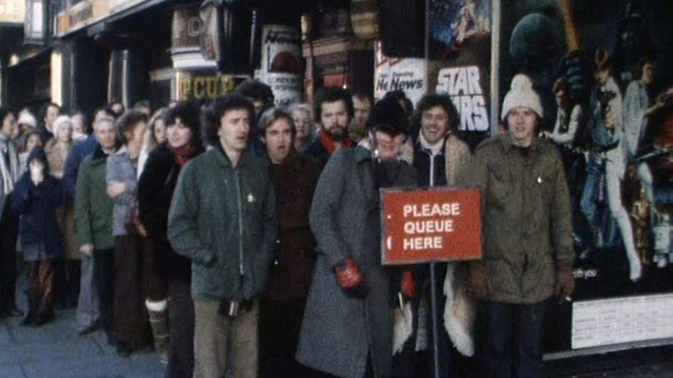 People in the UK queue to watch the original Star Wars in 1977.