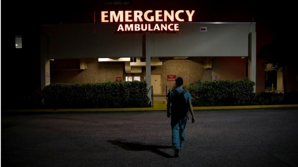 a resident ER doctor at Holy Cross Hospital, arrives at work for the start of his shift