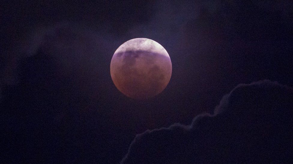 The moon is seen during a lunar eclipse referred to as the super blue blood moon, in Jakarta on 31 January 2018.
