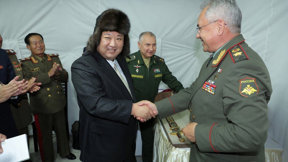 Kim Jong Un shakes hands with Russia's Defence Minister Sergei Shoigu, as he visits Vladivostok, Russia, September 16, 2023