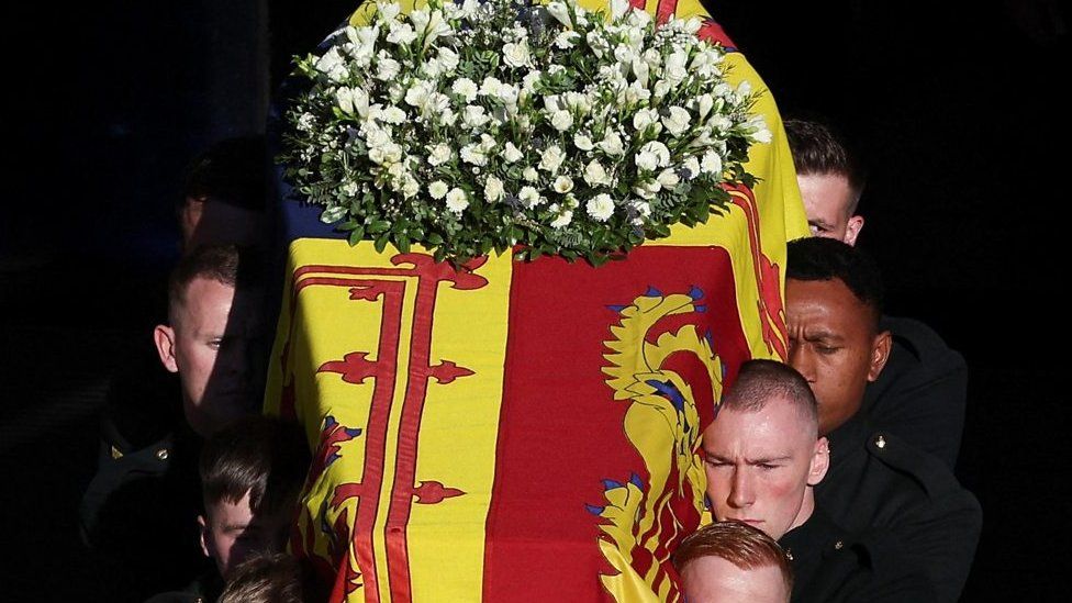 Pallbearers carry the Queen's coffin