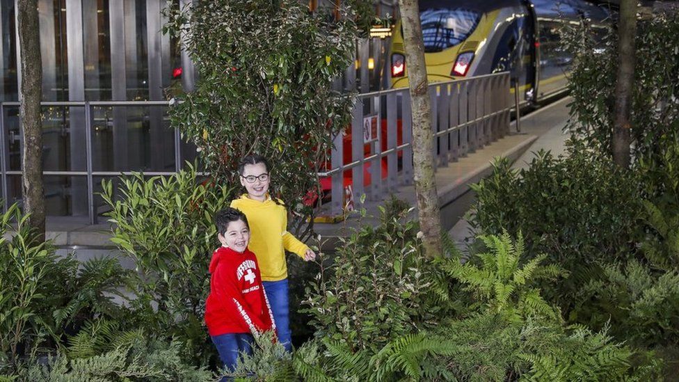 Children playing in a woodland created to mark Eurostar's 25th birthday