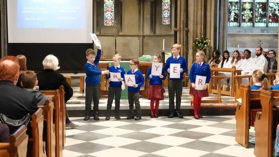 Pupils leading a church service