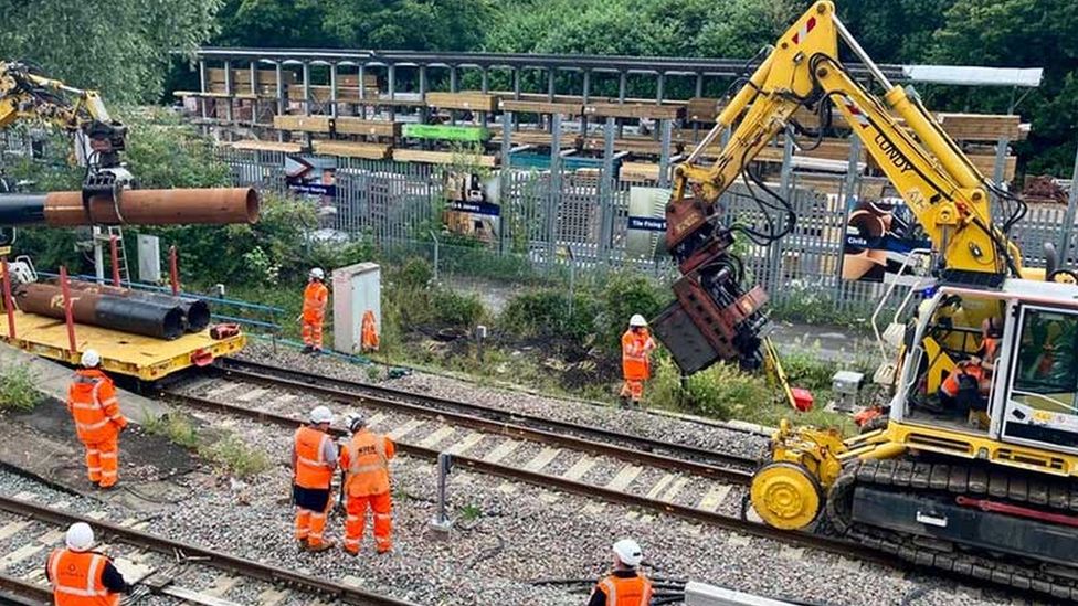 Workers repairing a railway track