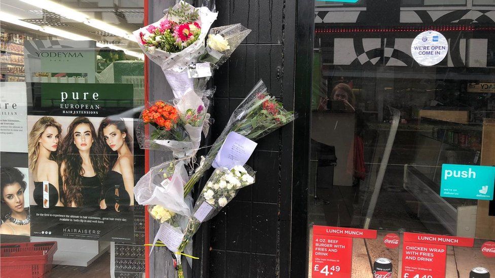 Floral tributes left outside the takeaway food shop