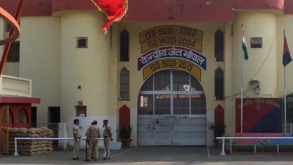 Indian police officials gather at the entrance to The Central Jail in Bhopal on November 1, 2016, a day after some inmates escaped and were killed in an encounter with security personnel.