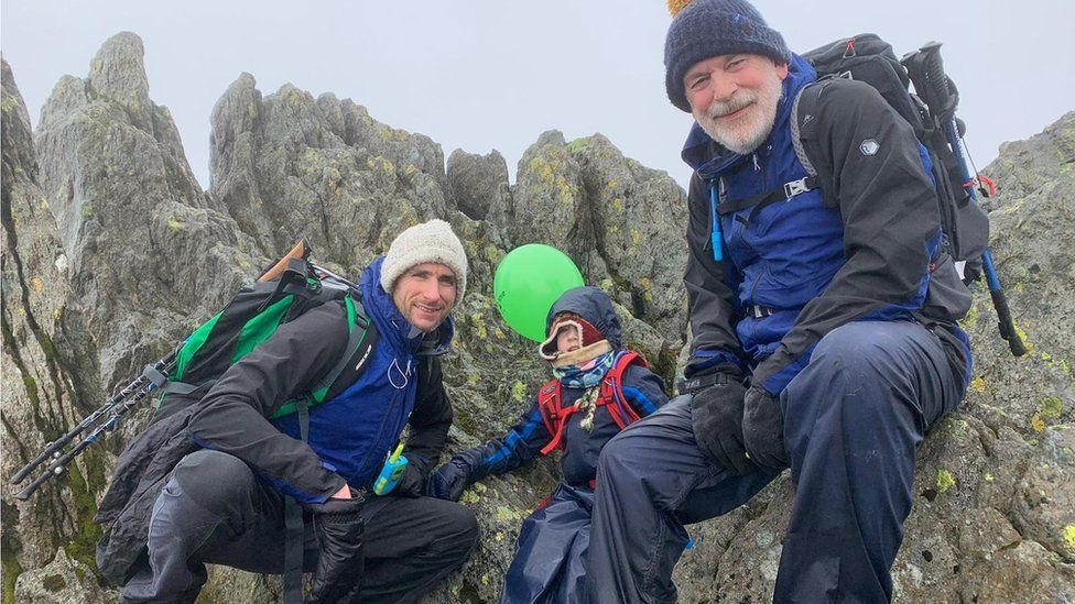 Oscar with his Dad and Grandad up a mountain