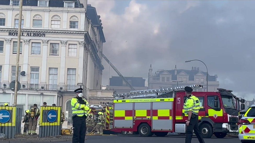 Police officers and fire engines in front of the Royal Albion Hotel