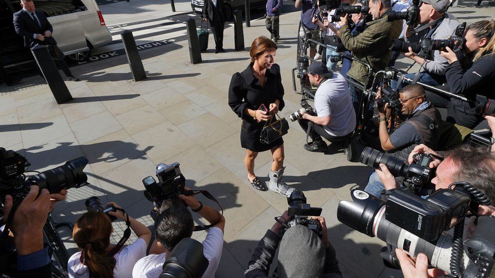 Coleen Rooney being photographed at the High Court