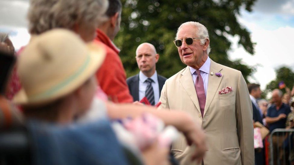 King Charles III meets members of the public during a visit to the Sandringham Flower Show