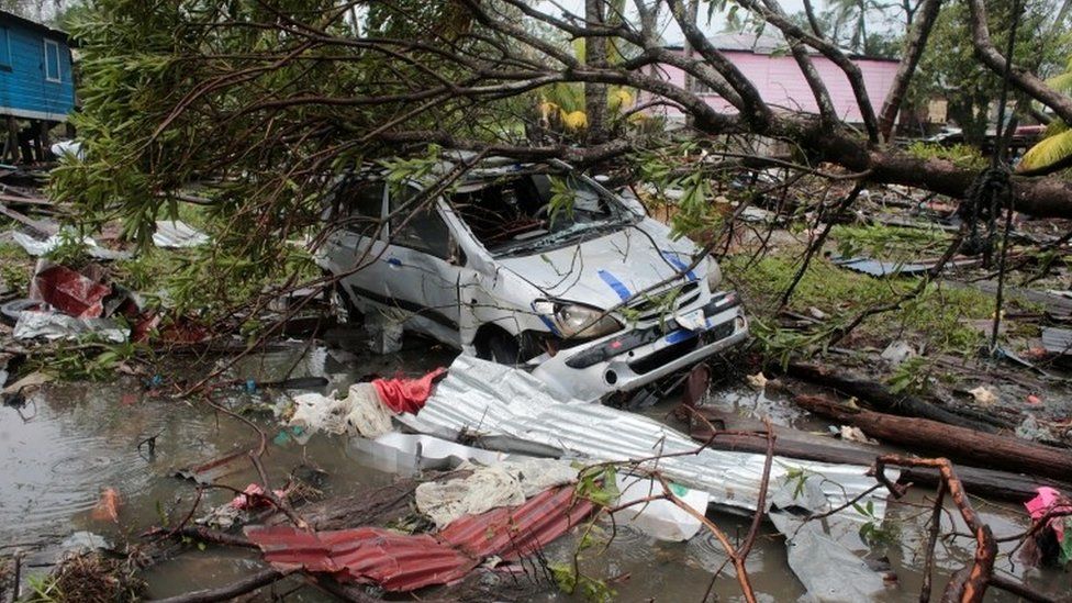 A car damaged by a tree is pictured after the passing of Hurricane Iota, in Puerto Cabezas, Nicaragua