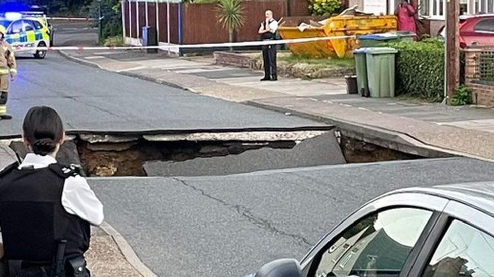 The Bexleyheath sinkhole with police looking on and cordons in place
