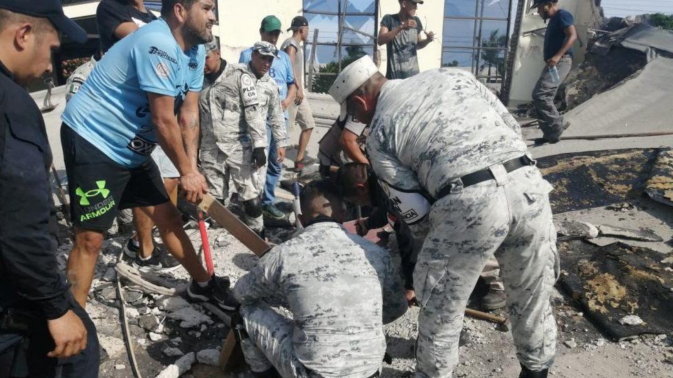 Members of security forces and people work at a site where a church roof collapsed during Sunday mass in Ciudad Madero, in Tamaulipas state, Mexico in this handout picture distributed to Reuters on October 1, 2023.